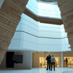 create a modern museum with visitors inside